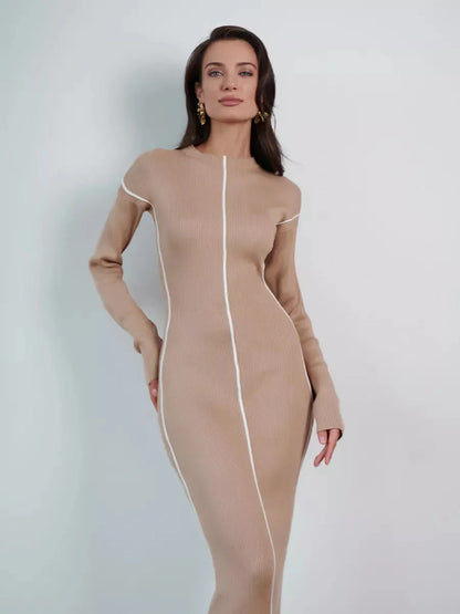 Elegant sculpted line midi dress in soft beige, featuring refined seams for a flattering silhouette.