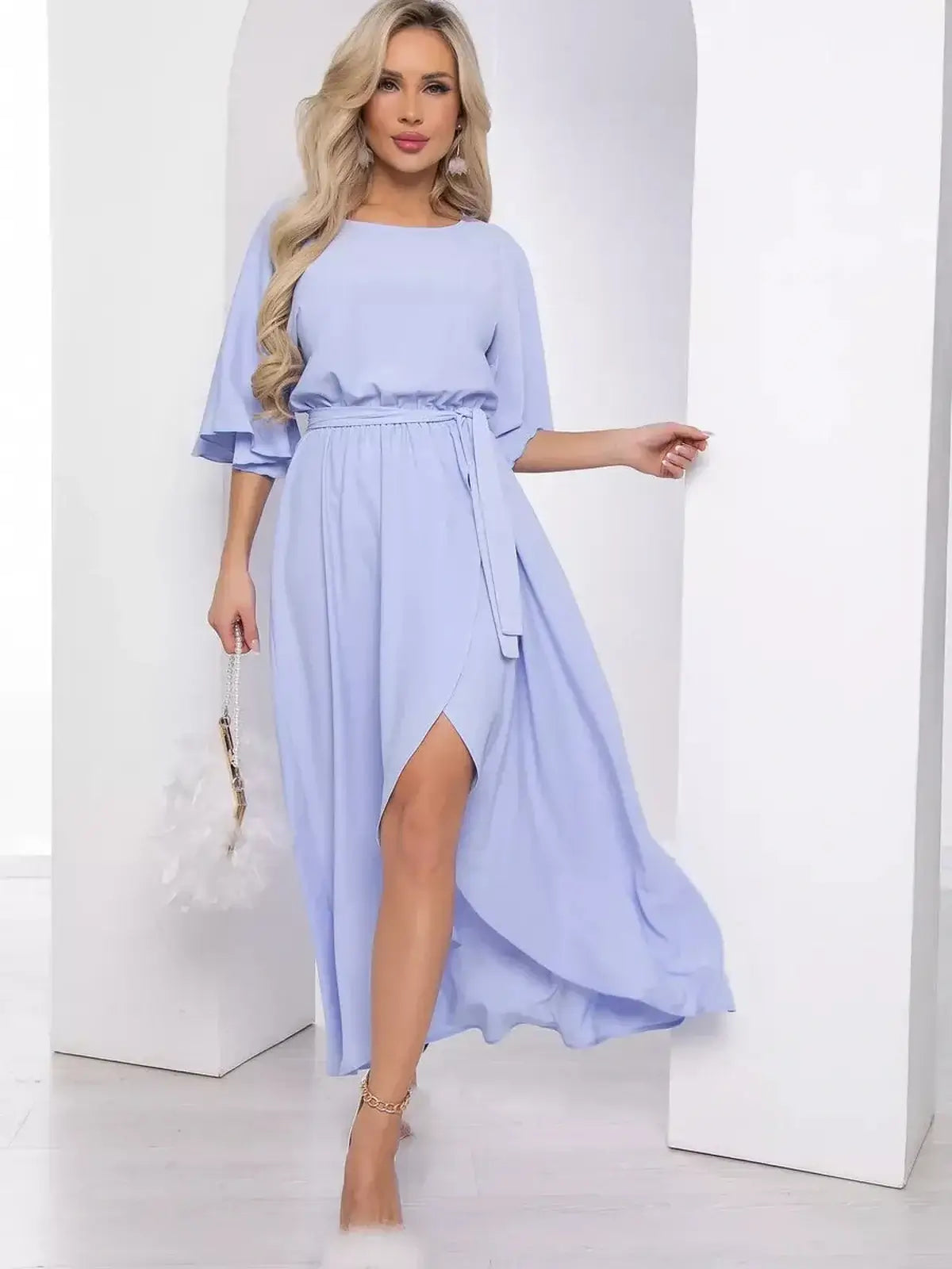 Elegant Grace Flutter Midi Dress in soft blue, featuring flowing sleeves and a chic wrap skirt, perfect for summer events.