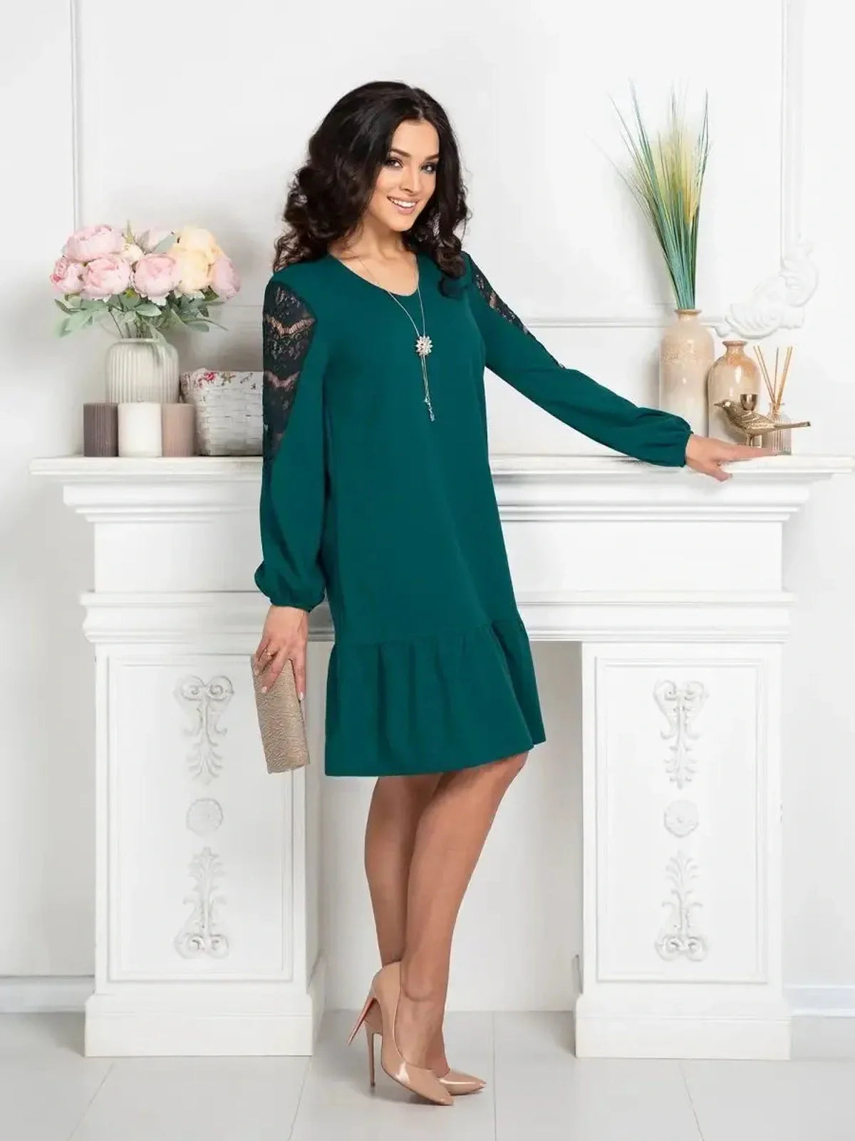 Model wearing the Lace Charm mini dress in teal with lace detailing, perfect for casual and formal occasions.