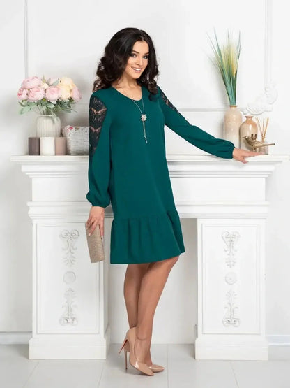 Model wearing the Lace Charm mini dress in teal with lace detailing, perfect for casual and formal occasions.