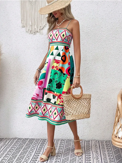 Tropica Muse Midi Dress in vibrant patterns, perfect for summer weddings and elegant outings.