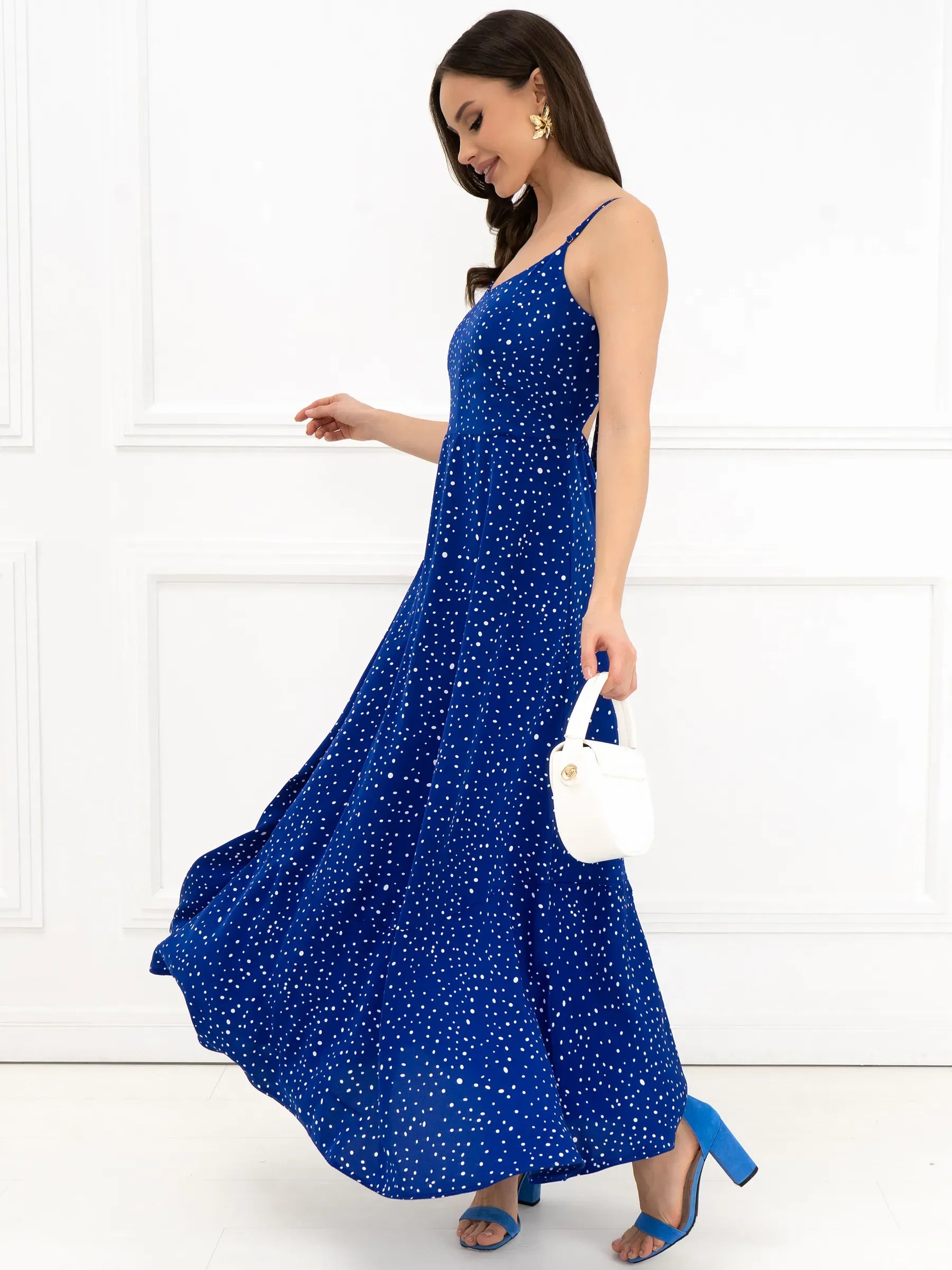 Electric blue Celeste maxi dress with back bow detail, perfect for summer weddings and special occasions.