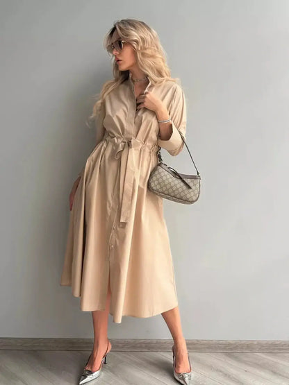 Studio Beige Midi Dress styled with a belt, perfect for elegant occasions and versatile for weddings and formal events.