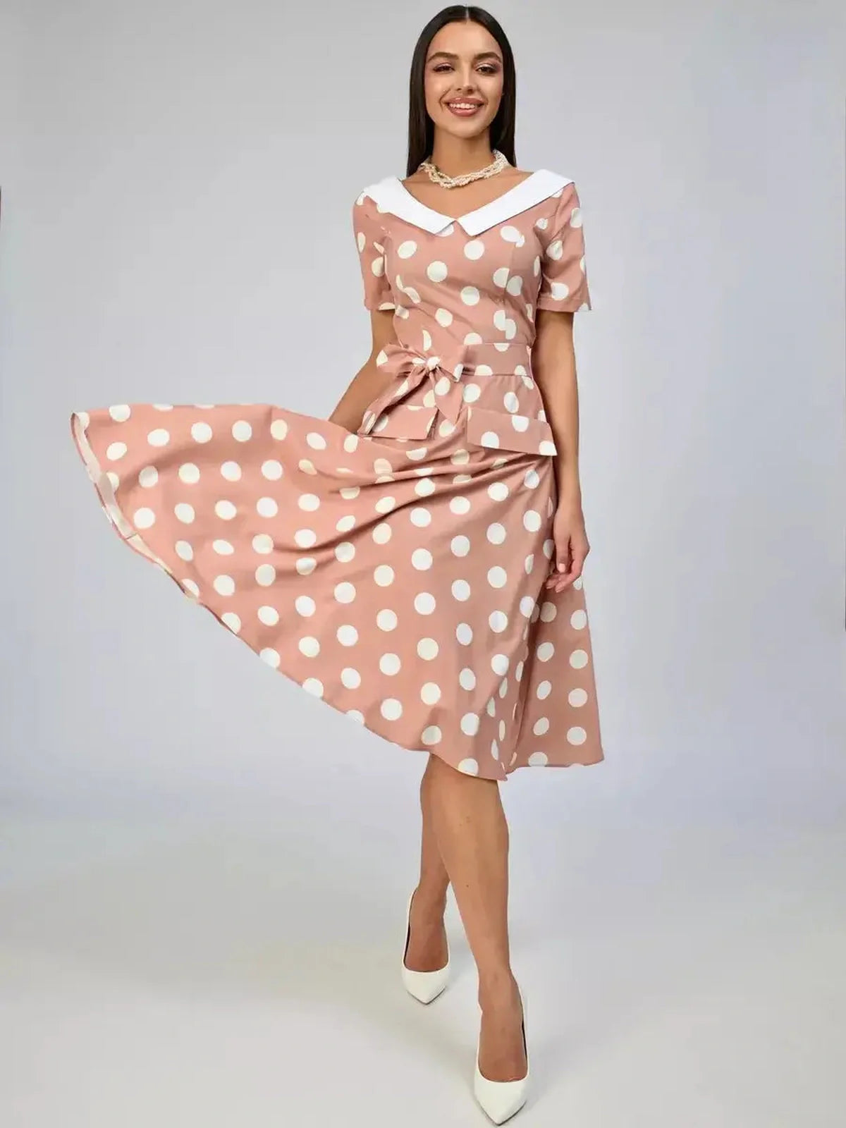 Vintage Muse Midi Dress featuring polka dots and white collar, perfect for summer events and wedding guests.