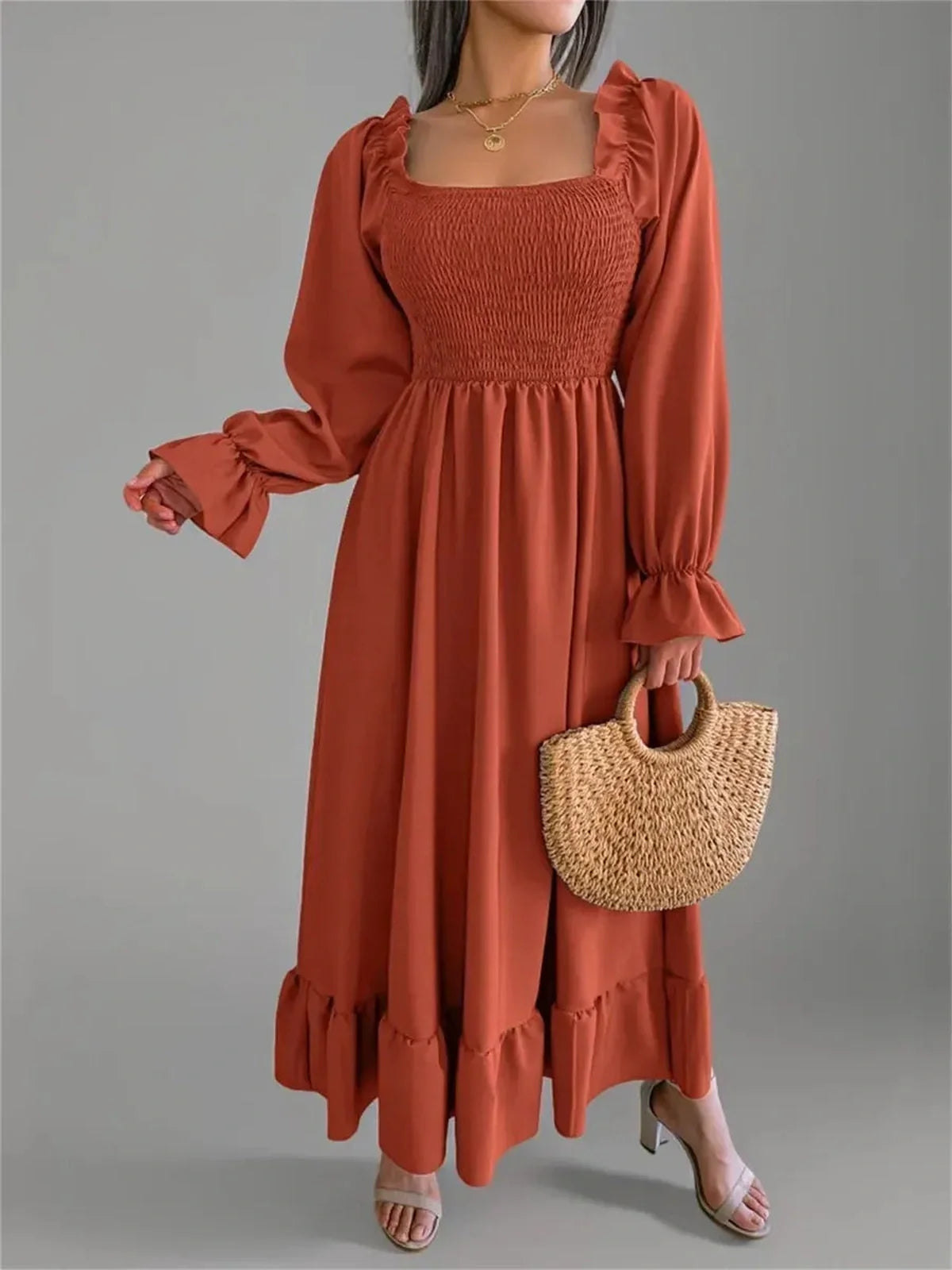 Rust Charm Midi Dress with smocked bodice and flounced hem, perfect for weddings and summer events.