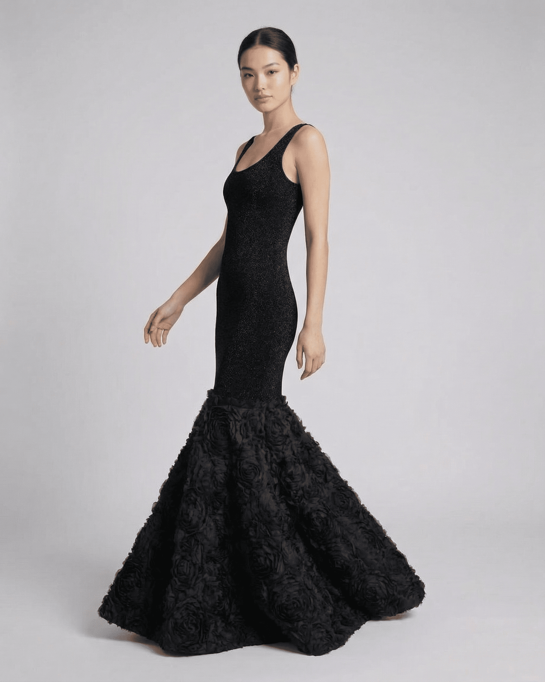 Sleek model showcasing the Slimona Nocturne Maxi Dress with textured hem detail in elegant black.