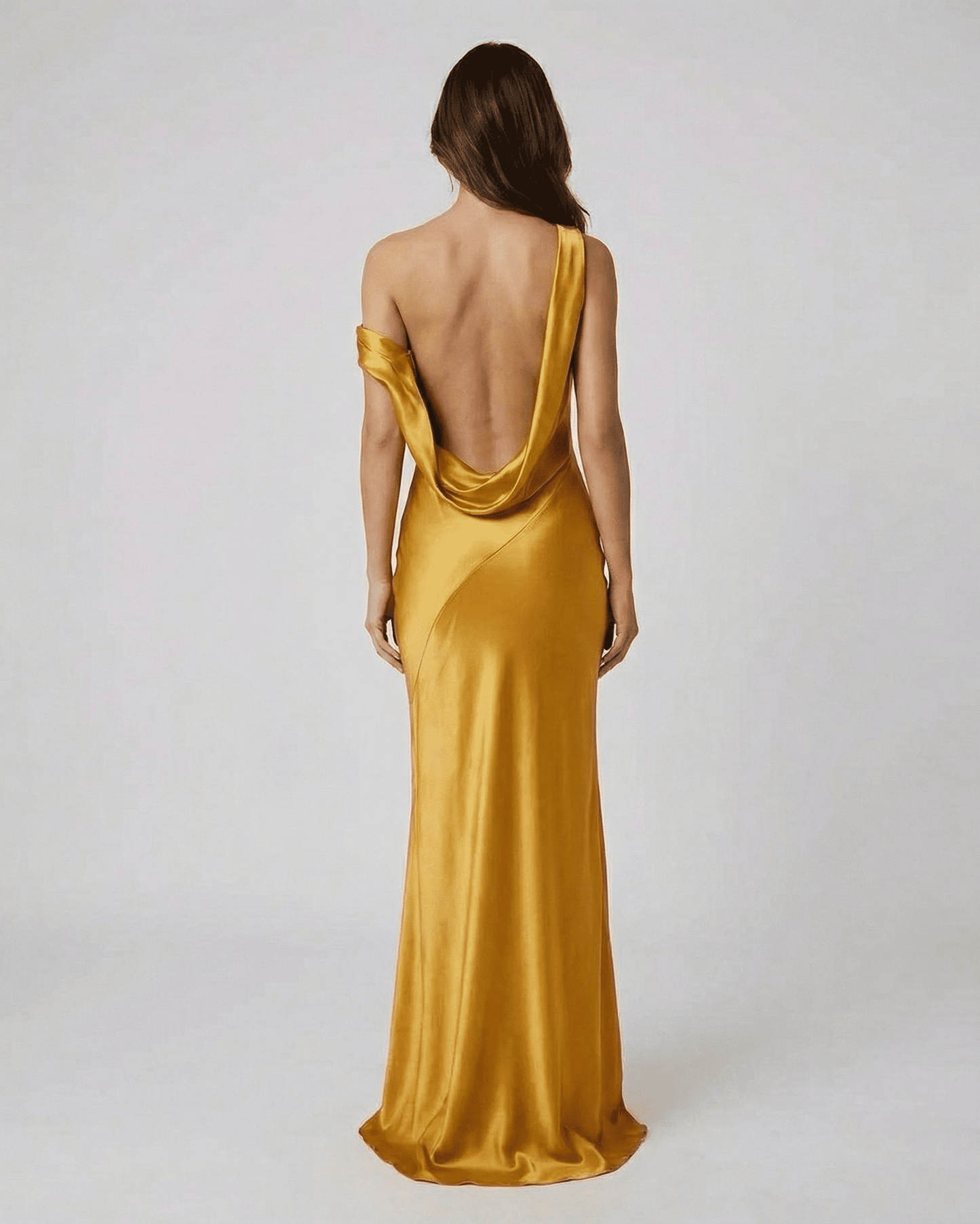 Aurelia Maxi Dress by Slimona — satin gold dress with open back and high waist, showcasing elegant silhouette from behind.