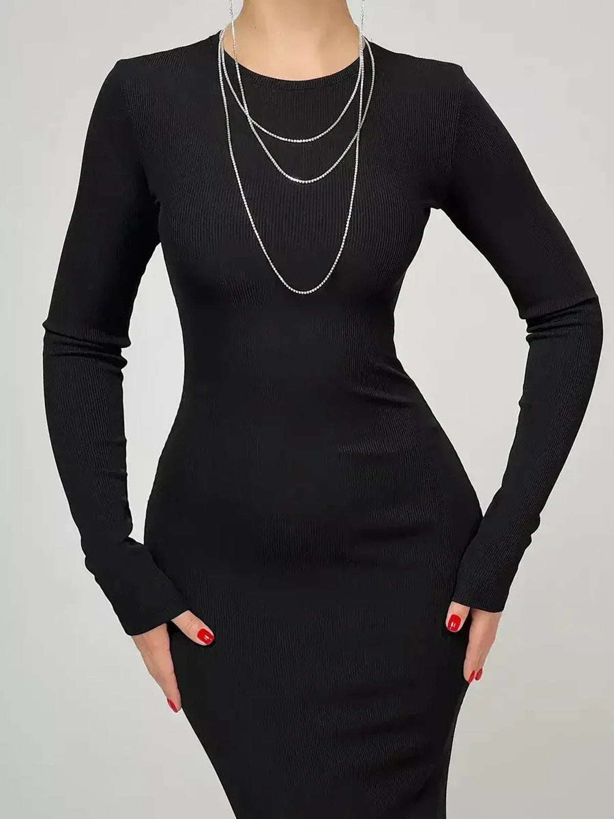 Sculpted Elegance Maxi Dress in black, featuring long sleeves and a sleek silhouette, perfect for formal events and special occasions.