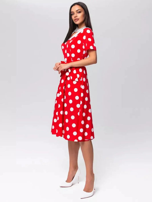 Retro Charm Midi Dress featuring red and white polka dots, a white collar, and a flattering tie belt for a chic vintage look.