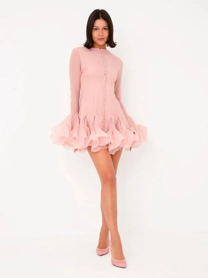 Rose Whirl Mini Dress in pink chiffon featuring flounced hem and button detailing, perfect for summer celebrations.