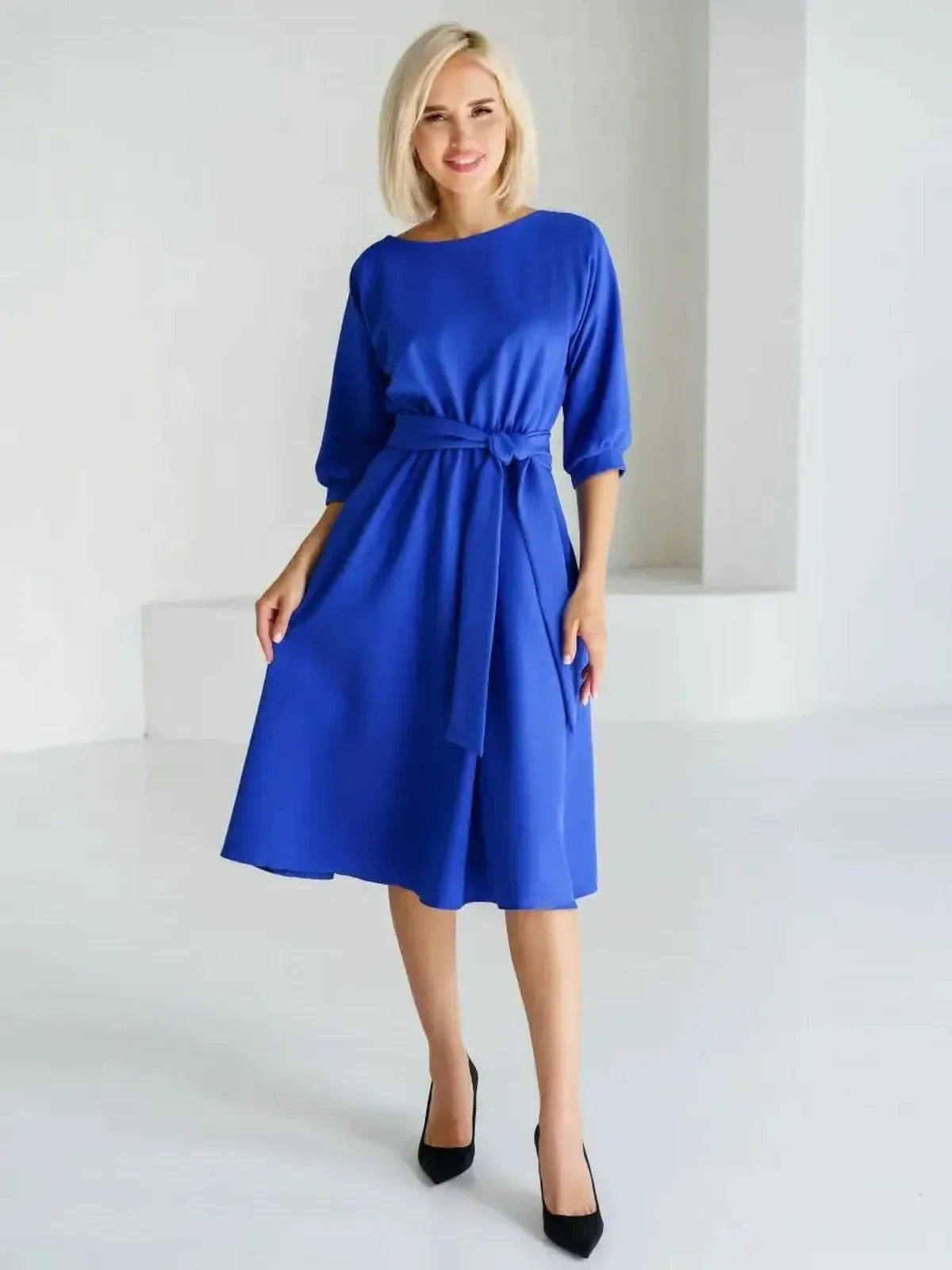 Sapphire belted midi dress in electric blue, featuring a structured silhouette and elegant style.
