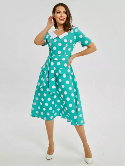 Polka Grace Midi Dress in teal with white polka dots, featuring a collar, tie waist, and pockets, perfect for summer and events.