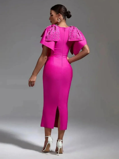 Fuchsia Pearl Cape Midi Dress showcasing a sleek silhouette and dramatic pearl-embellished cape detail, perfect for formal occasions.