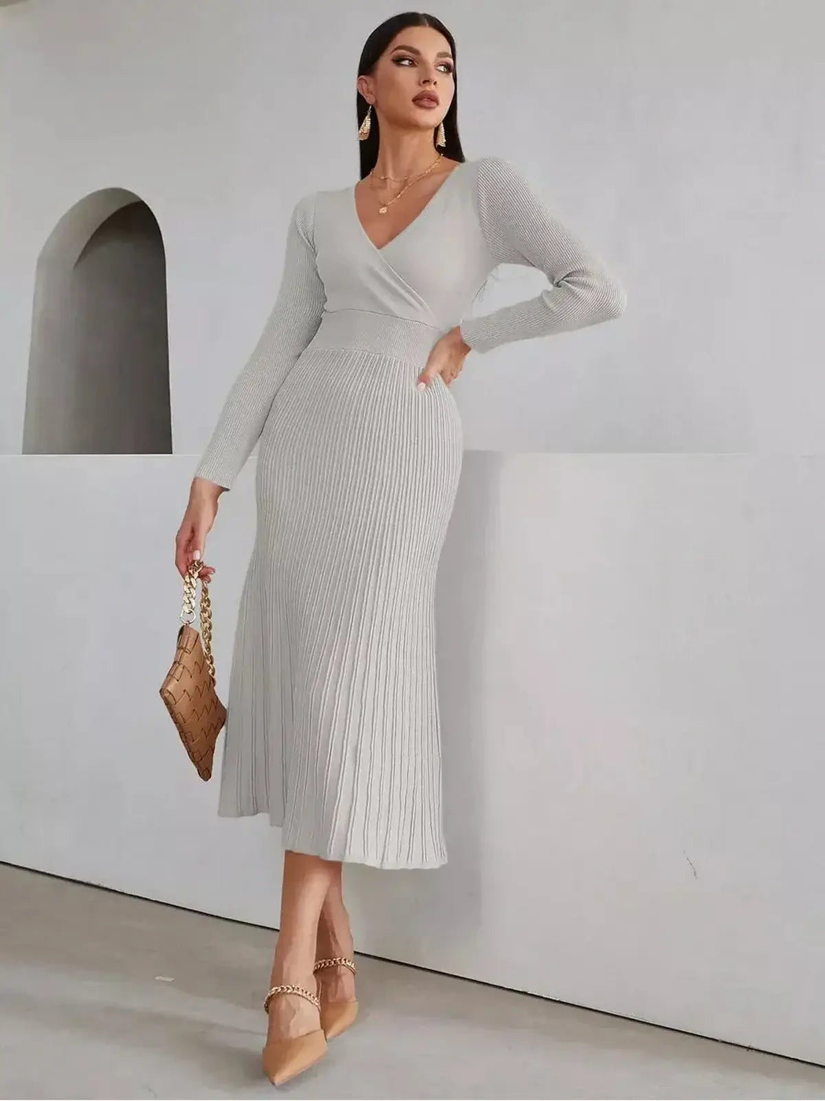 Sculpted Grace Midi Dress featuring a sleek ribbed texture and elegant fit, perfect for weddings and formal events.