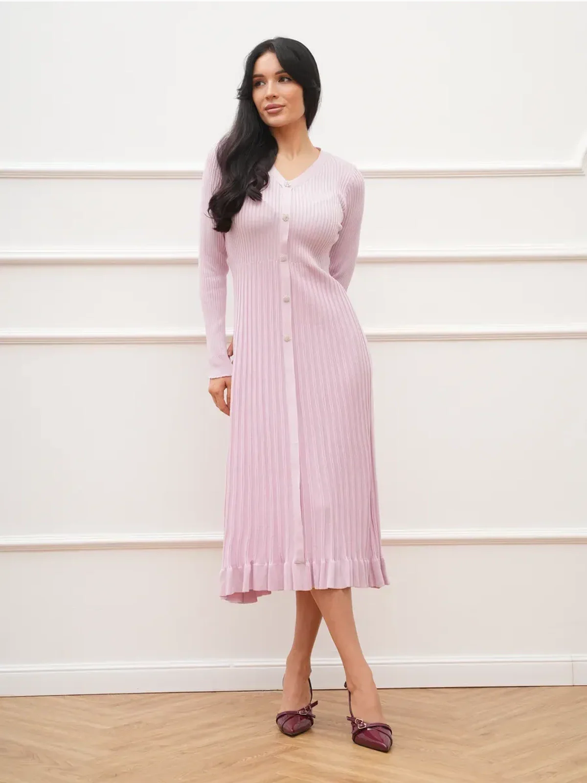 Elegant pink Crystal Knit Midi Dress with ribbed texture and fluted hem, perfect for weddings and formal events.