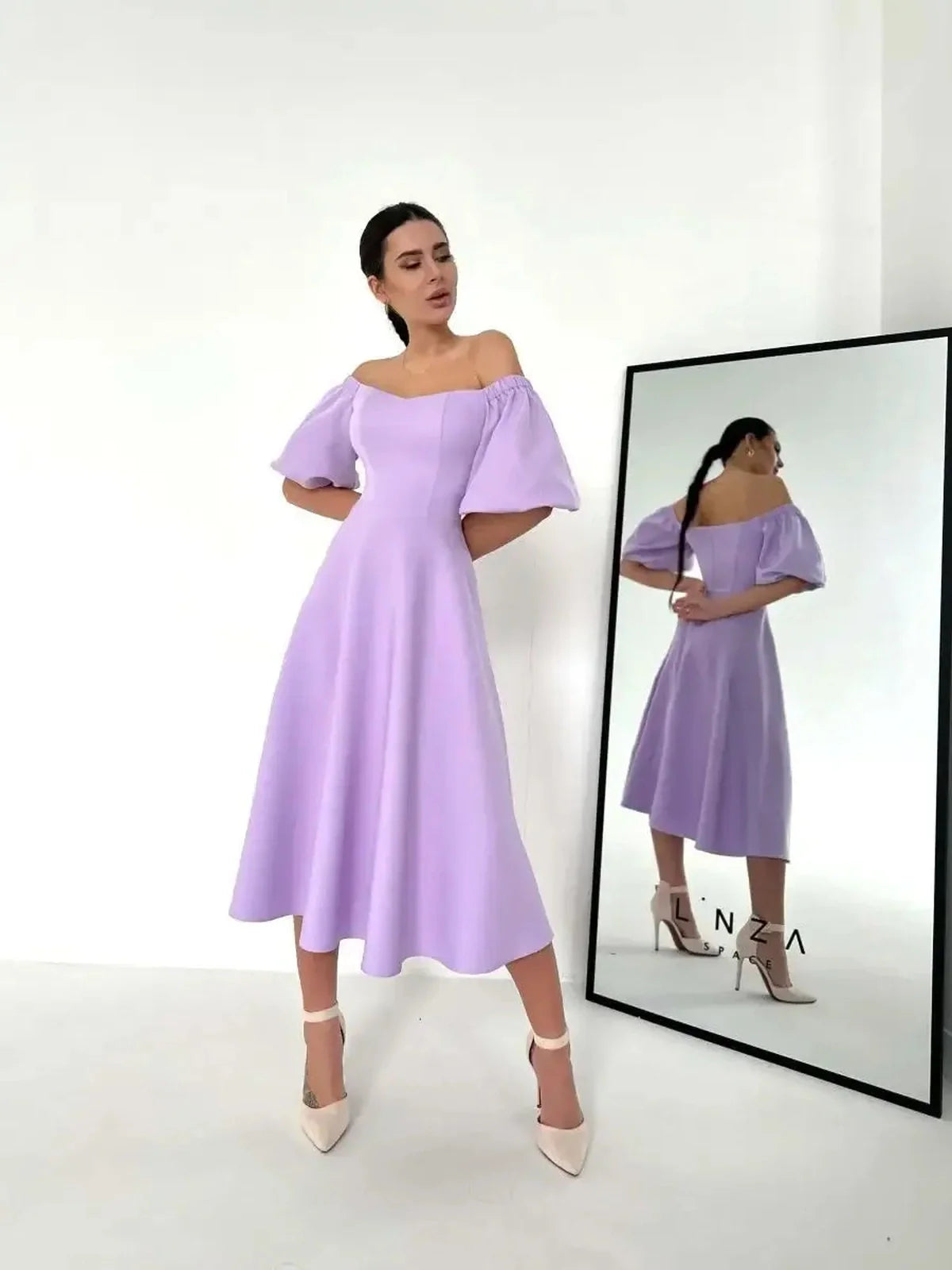 Lilac Grace Midi Dress featuring off-shoulder puff sleeves, perfect for weddings, garden parties, and summer soirées.