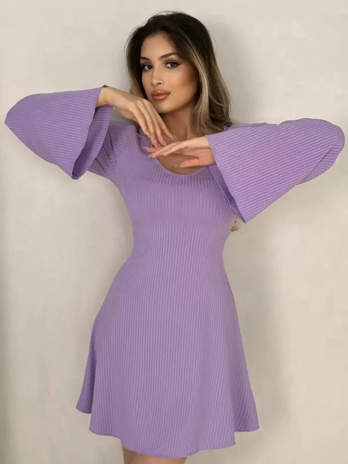 Lilac Grace Mini Dress featuring wide bell sleeves and a flattering fit-and-flare silhouette, perfect for weddings or casual outings.