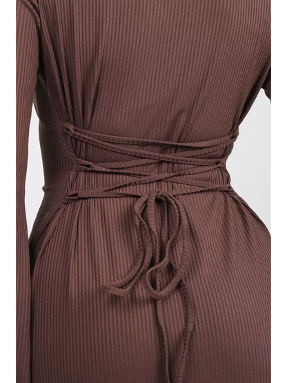 Close-up of the back detail of the Sculpted Grace Midi Dress, showcasing the textured knit and defining tie.