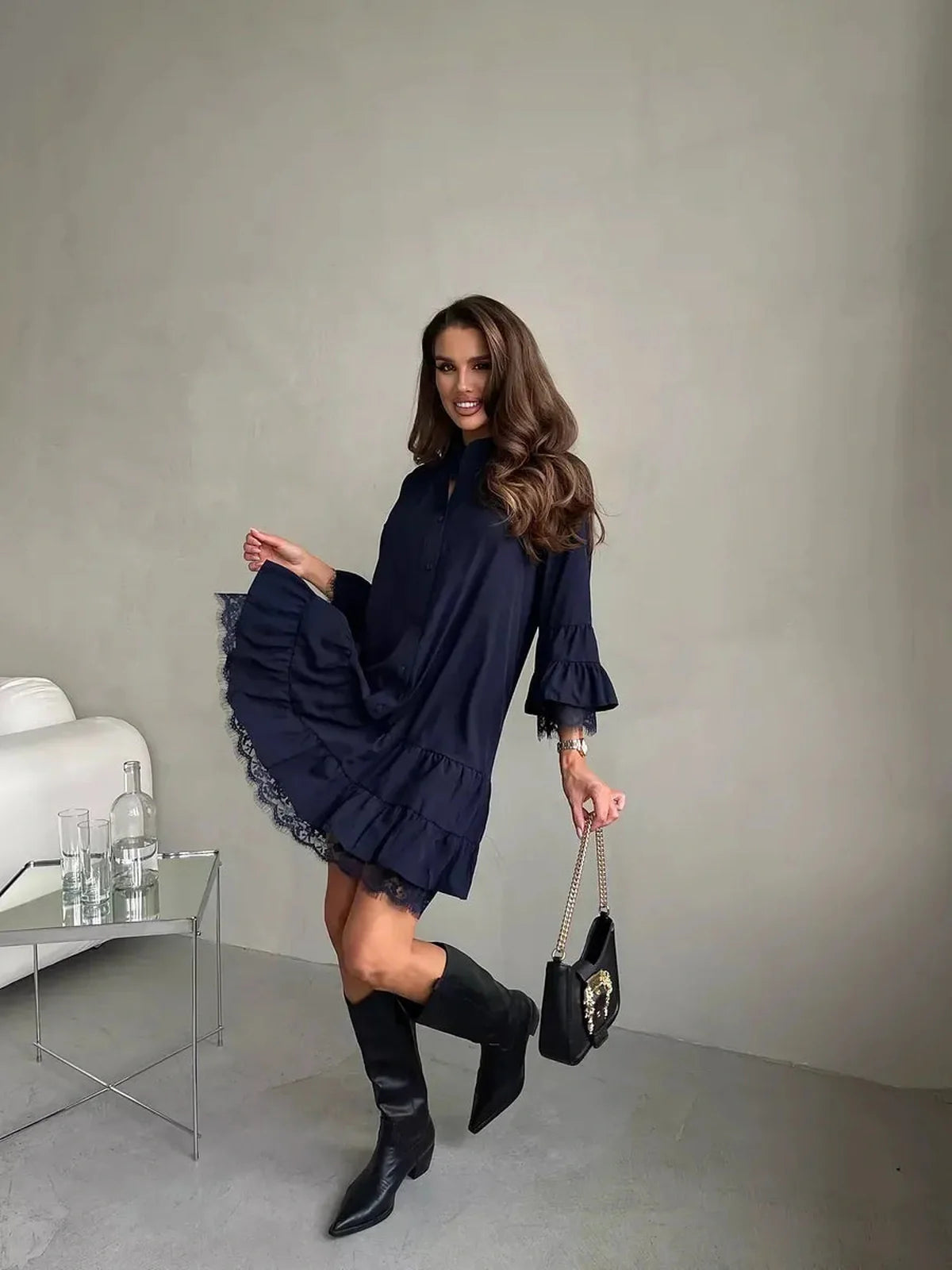 Model showing a navy lace flare mini dress with tiered ruffles, perfect for wedding guest, cocktail, or summer events.