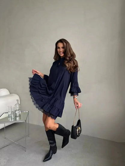 Model showing a navy lace flare mini dress with tiered ruffles, perfect for wedding guest, cocktail, or summer events.