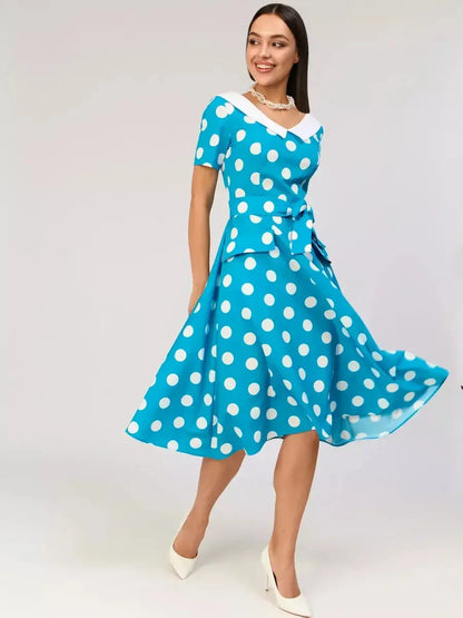Retro Charm Midi Dress in blue with white polka dots and contrast collar, ideal for summer weddings or cocktail events.