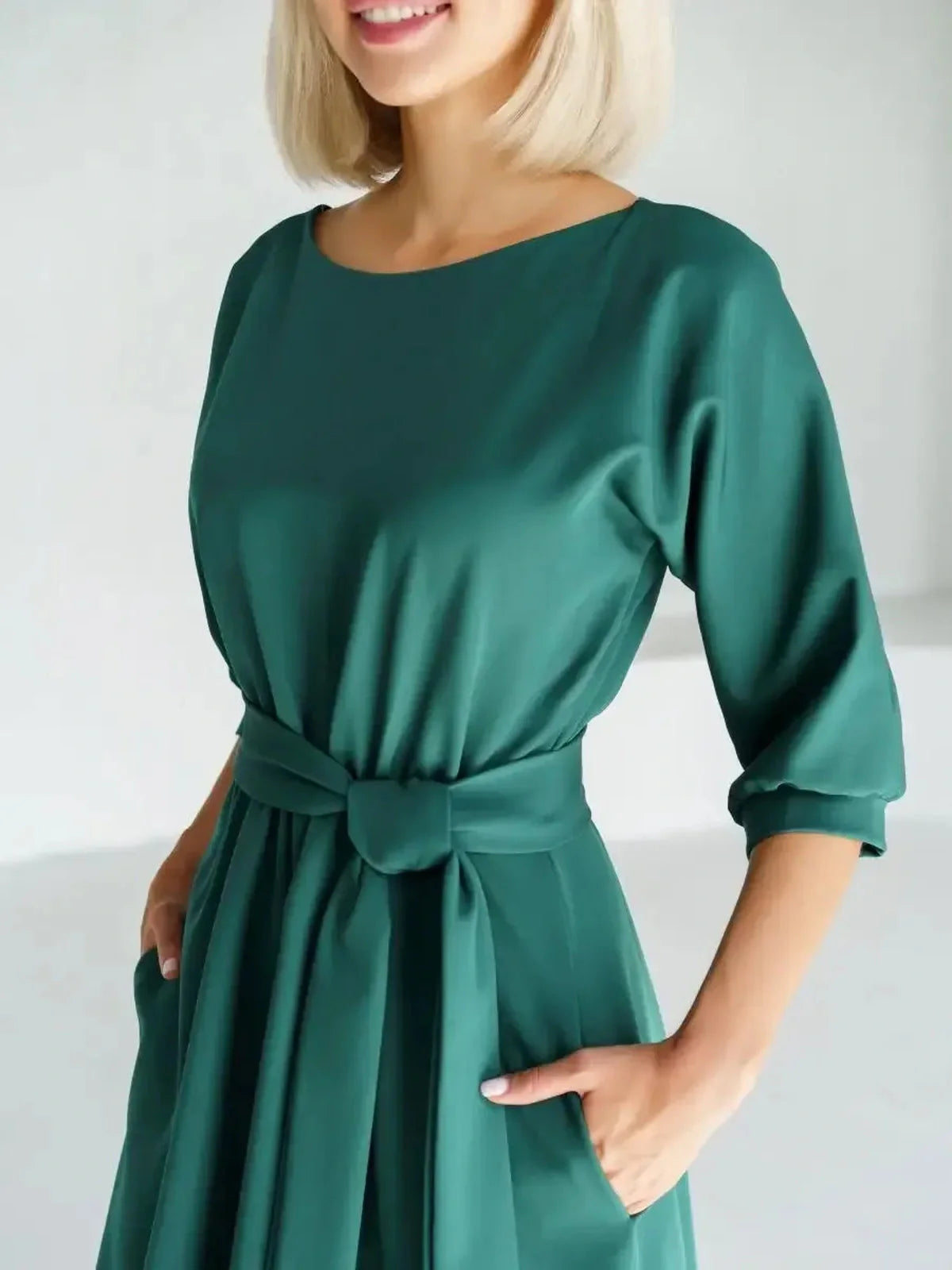 Emerald Aura Midi Dress featuring a belted waist, boat neckline, and elegant A-line silhouette in a rich green hue.