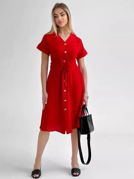 Model wearing a stylish Crimson Charm Midi Dress in bold red, featuring button-front and elegant waist tie.