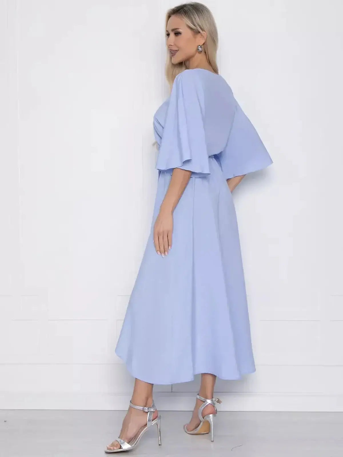 Celeste Midi Dress in soft blue featuring graceful flutter sleeves, perfect for summer weddings and elegant occasions.