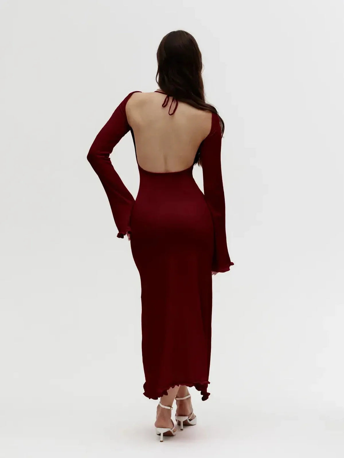 Elegant ruffle-back midi dress in burgundy, featuring an open back and long sleeves, perfect for weddings and formal events.