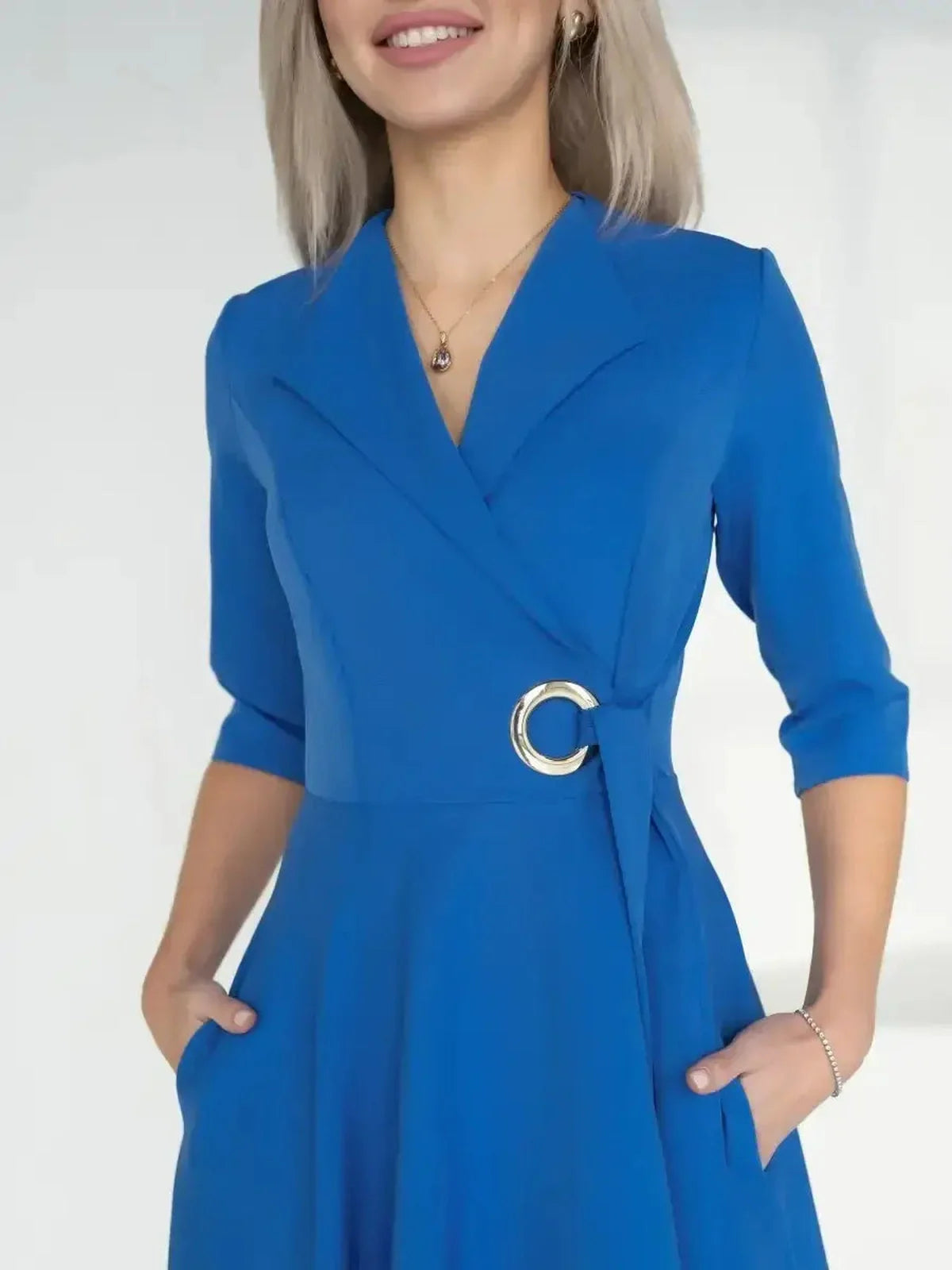 Sapphire Flow Midi Dress in royal blue with wrap silhouette and metallic waist detail, perfect for formal or elegant occasions.