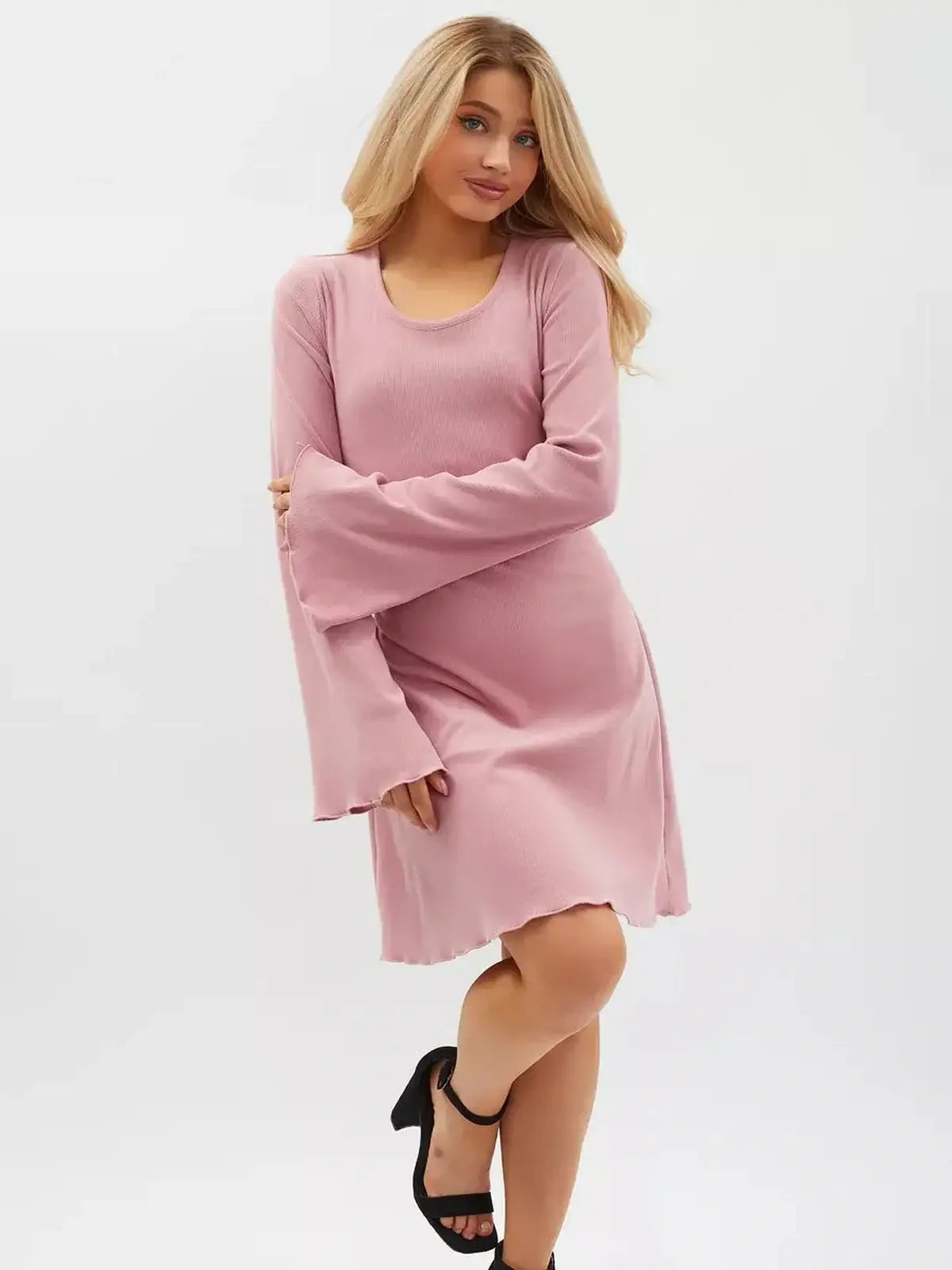 Model wearing a pink Rose Tie Mini Dress with flared sleeves and a lace-up waist, perfect for summer and special occasions.
