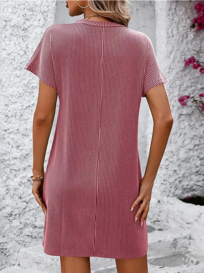 Back view of a ribbed pink mini dress, perfect for summer casual outings or as a versatile women's clothing option.