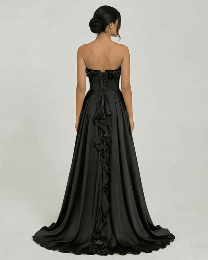 Back view of Noirelle Maxi Dress by Slimona, featuring strapless design and elegant ruffle detail.