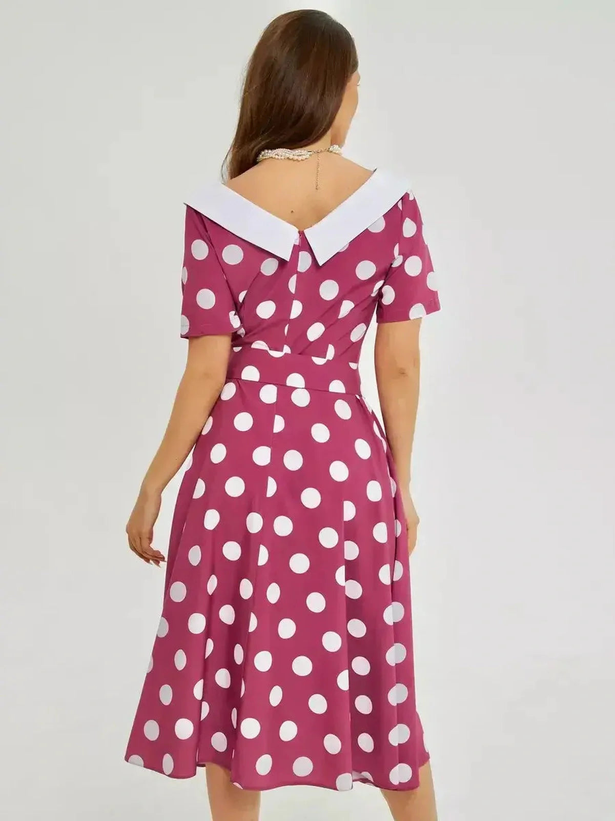 Back view of a Retro Dot Midi Dress featuring bold polka dots and a stylish white collar, perfect for summer events.