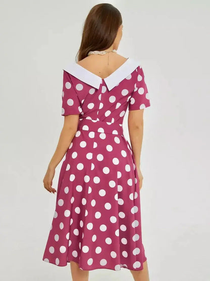 Back view of a Retro Dot Midi Dress featuring bold polka dots and a stylish white collar, perfect for summer events.