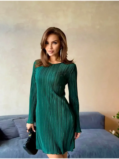 Emerald Veil mini dress in crinkle texture, featuring long sleeves and a flattering fit for elegant occasions.