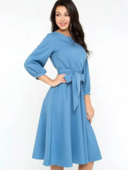 Sky Belle Midi Dress in soft blue, featuring a self-tie belt, 3/4 sleeves, and a flattering A-line silhouette.