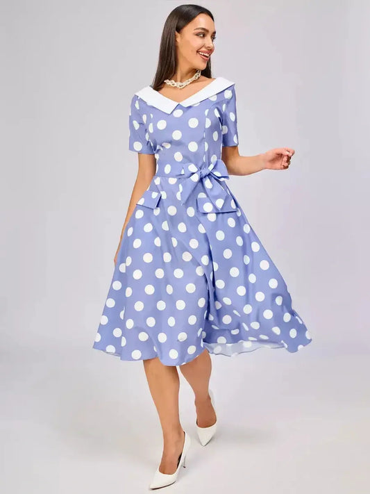 Vintage sky-blue midi dress with white polka dots, contrast collar, and waist tie, perfect for summer weddings and formal events.
