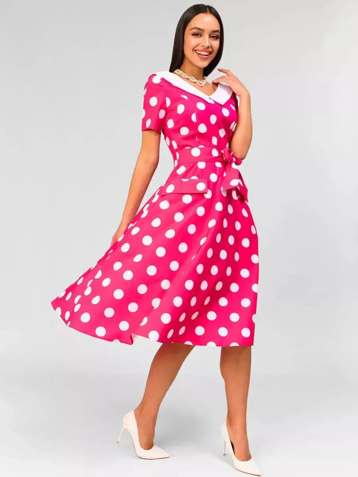Monaco Charm Midi Dress in pink polka dots with white collar, perfect for weddings or summer parties.