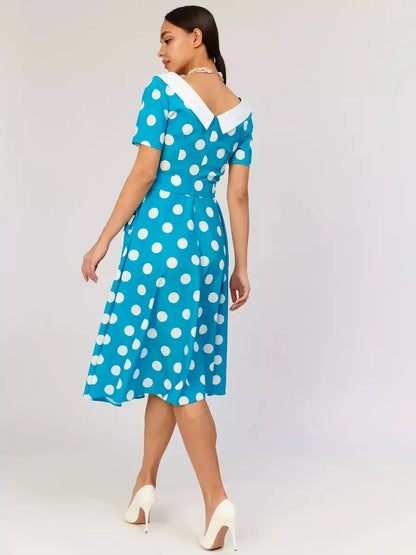 Back view of a Retro Charm Midi Dress featuring white polka dots and a contrasting collar, perfect for summer events.