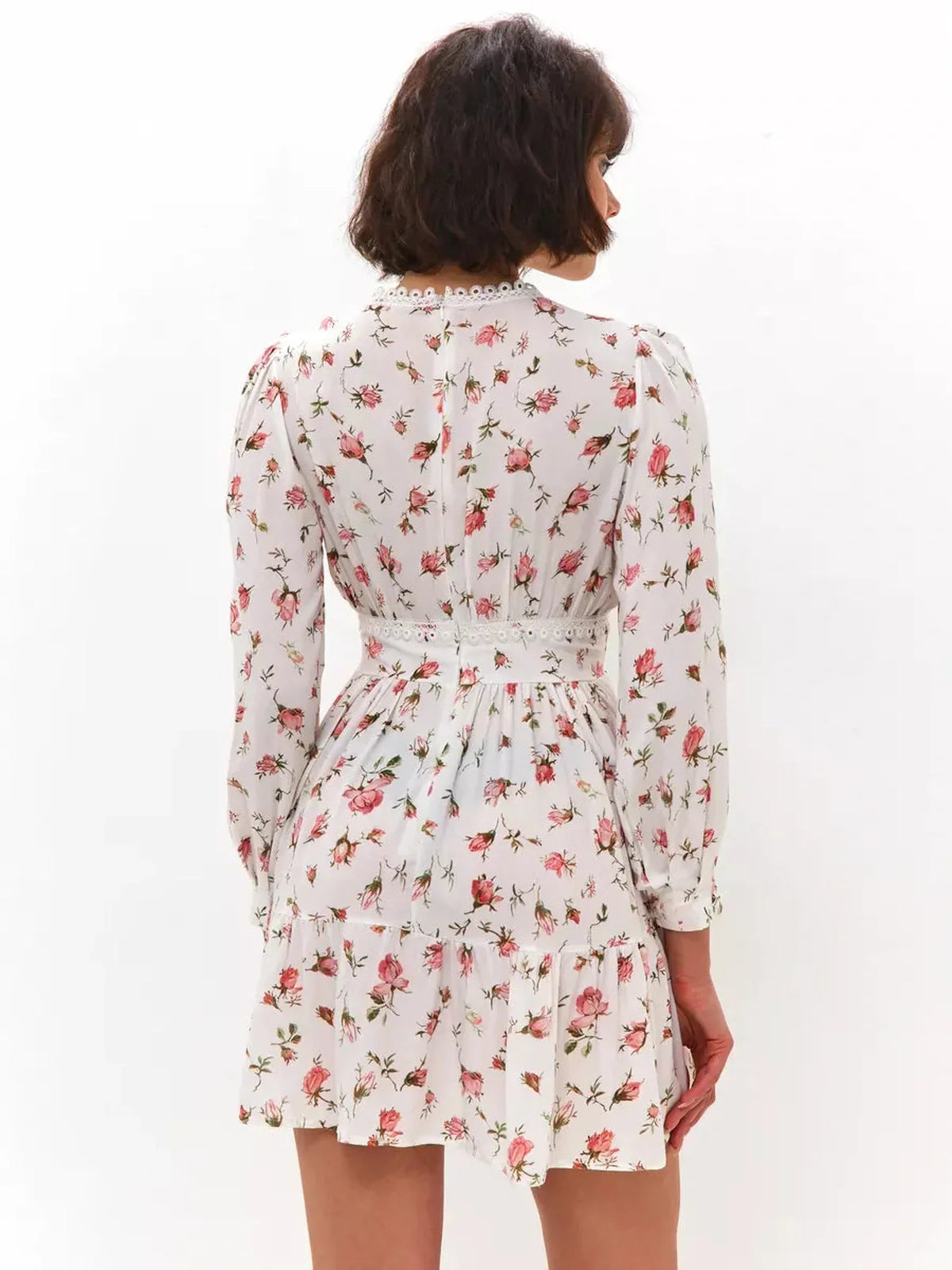 Back view of the Rose Whimsy Mini Dress featuring a floral design and lace details, perfect for summer gatherings.