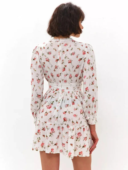 Back view of the Rose Whimsy Mini Dress featuring a floral design and lace details, perfect for summer gatherings.