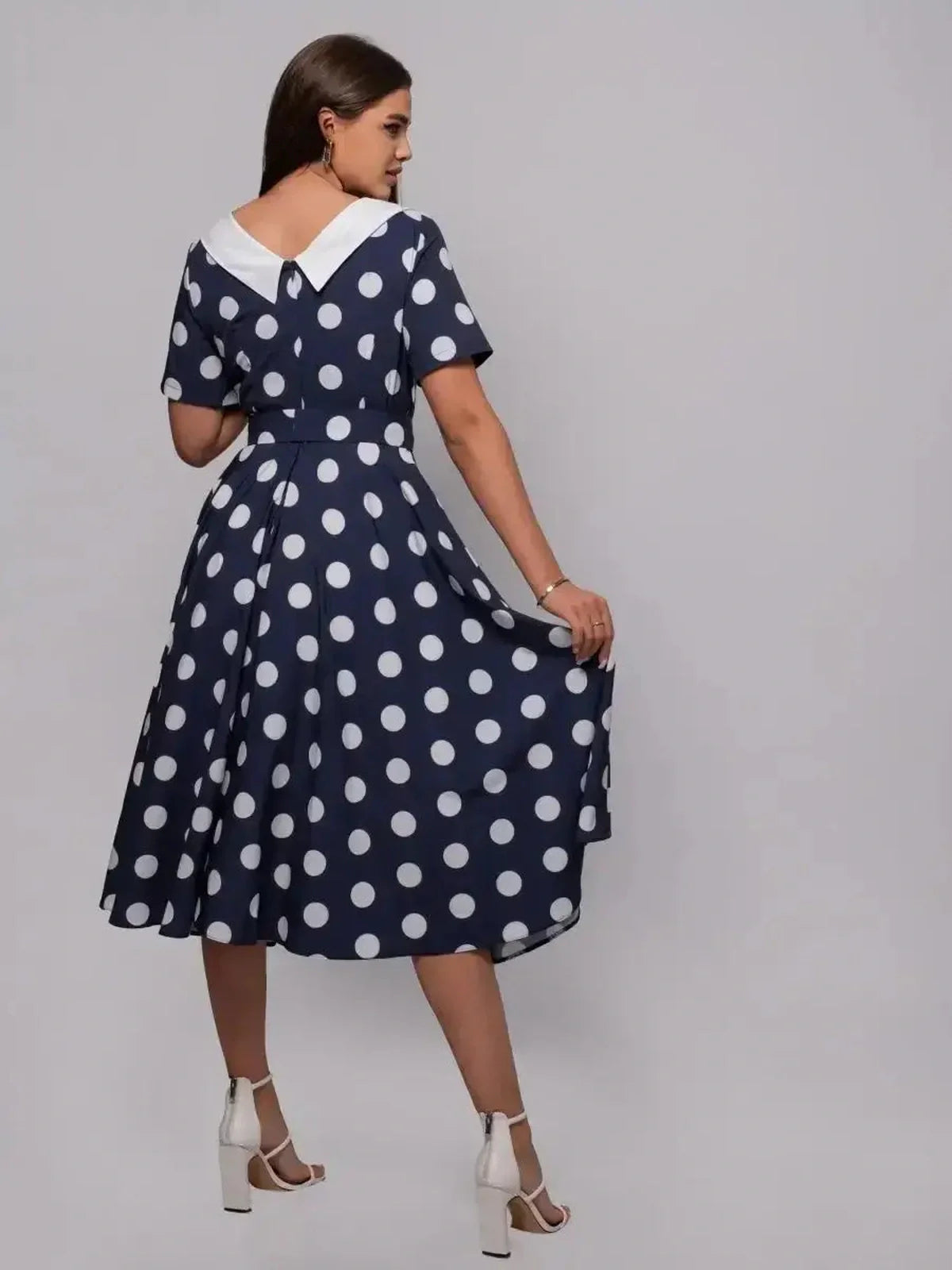 Nautical Charm Midi Dress featuring polka dots and a white collar, perfect for summer events and wedding guest attire.