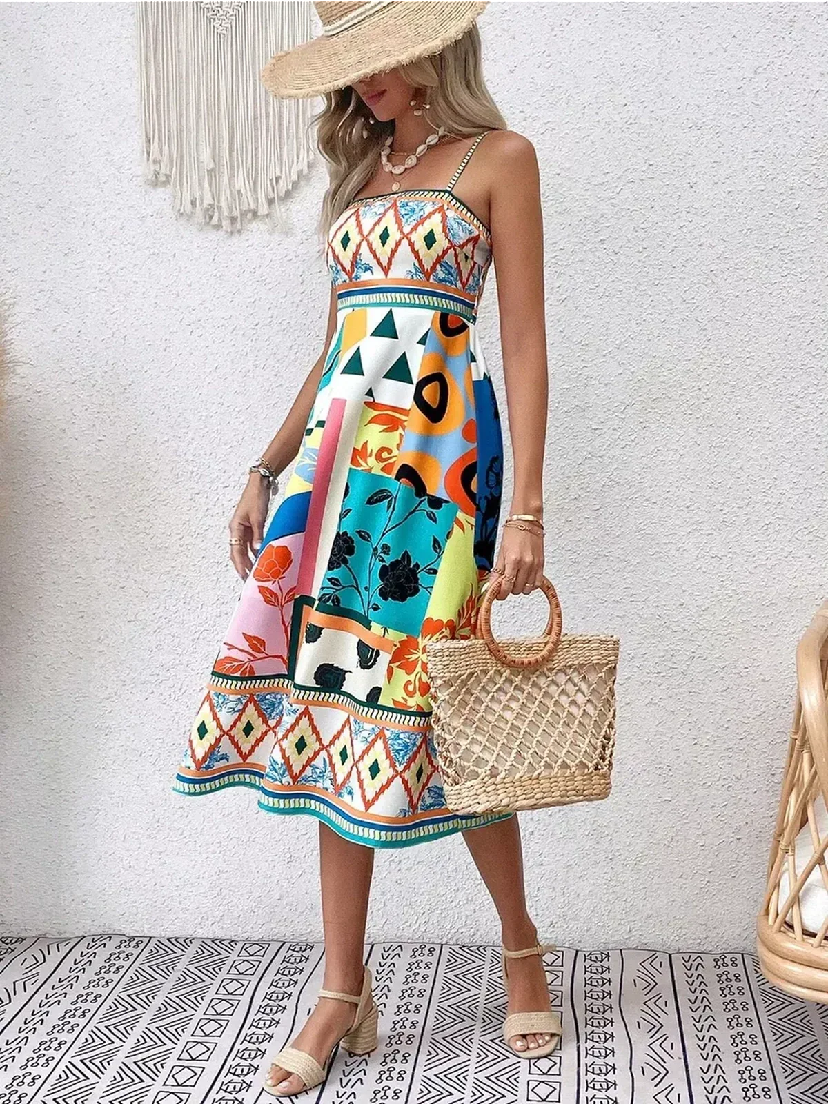 Model wearing a vibrant Festival Bloom Midi Dress with colorful patterns, perfect for summer weddings and casual outings.