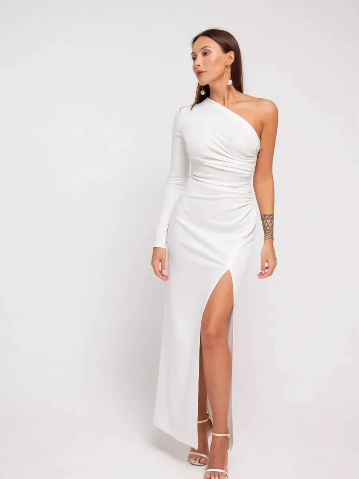 Celeste Maxi Dress featuring a one-shoulder silhouette, draped details, and high side slit, perfect for formal occasions.