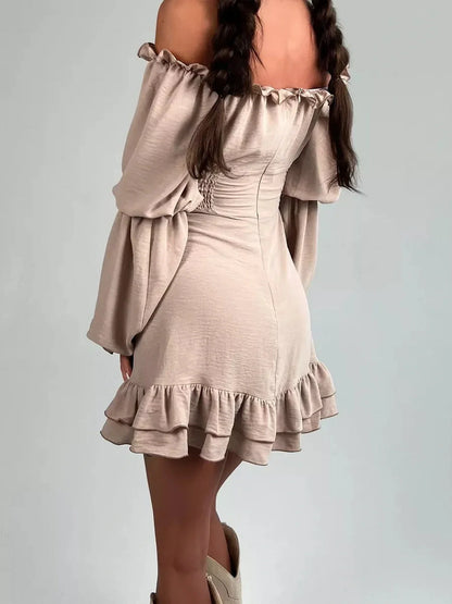 Back view of a beige off-shoulder Ruffle Muse Mini Dress with puff sleeves and flounced hemline, perfect for summer parties.