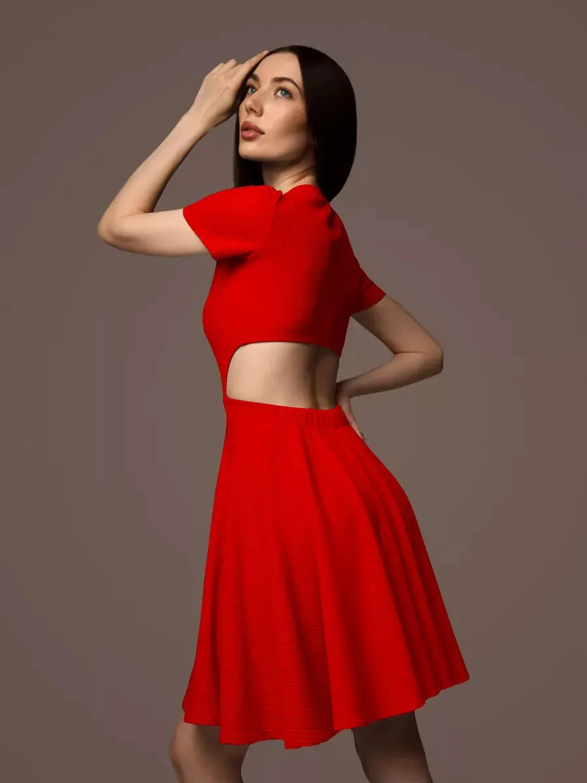 Stylish woman in a red flare cutout mini dress, ideal for summer weddings and cocktail parties.