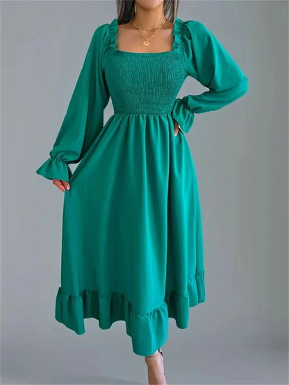 Meadow Ruffle Midi Dress in green featuring a smocked bodice and ruffled sleeves, perfect for weddings and formal occasions.