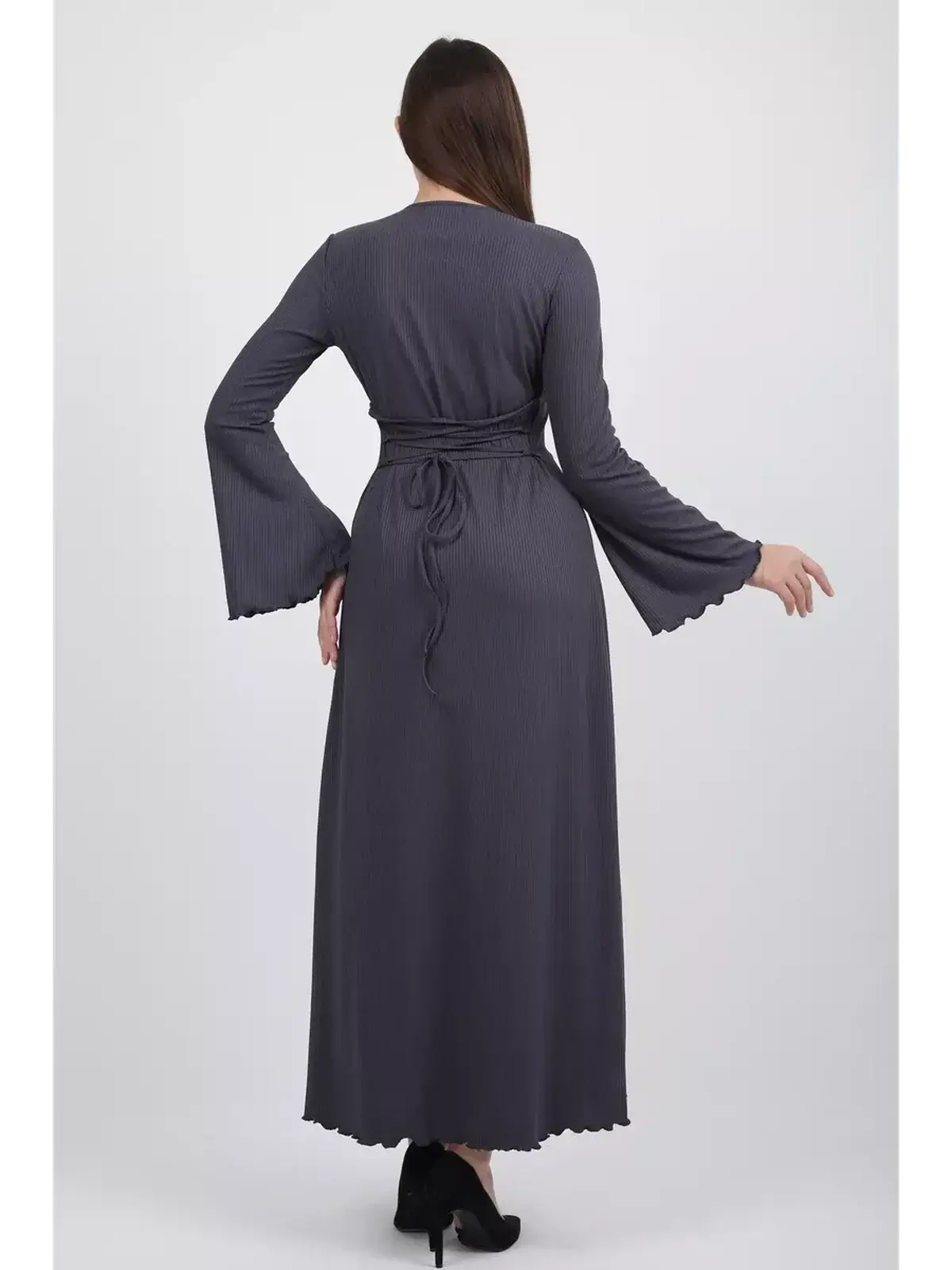 Back view of the Twilight Curve Midi Dress in charcoal grey, featuring flared sleeves and a tie waist for an elegant silhouette.