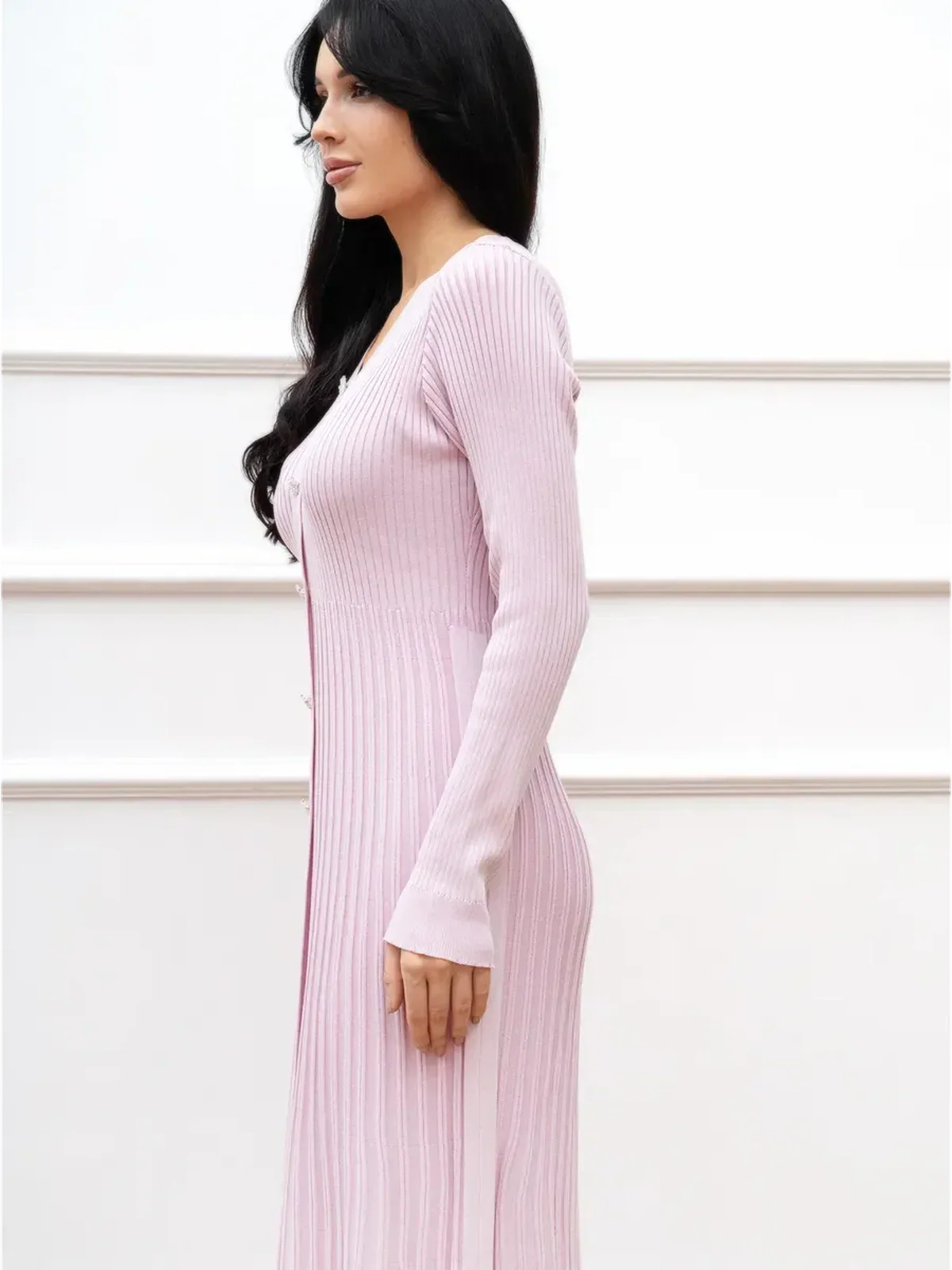 Elegant pink midi dress featuring ribbed texture and a flattering fit, perfect for wedding guest or formal occasions.
